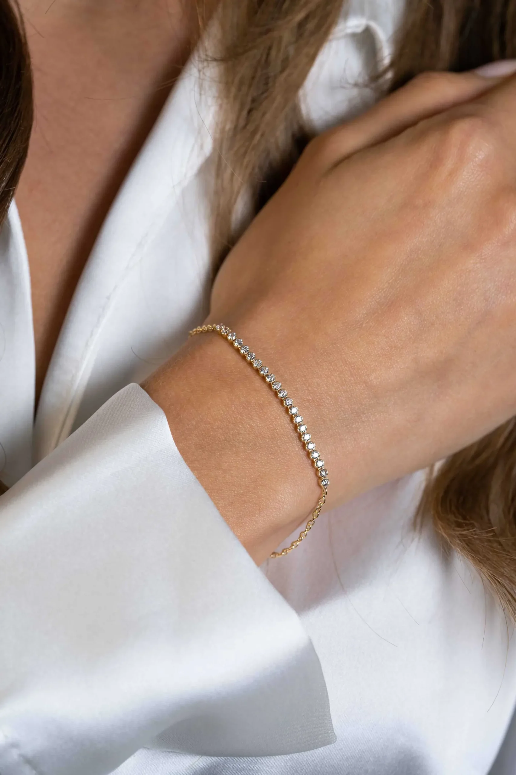 ZINZI gold plated zilveren armband, in het midden bezet met 21 witte zirconia's 16-19cm ZIA2370Y