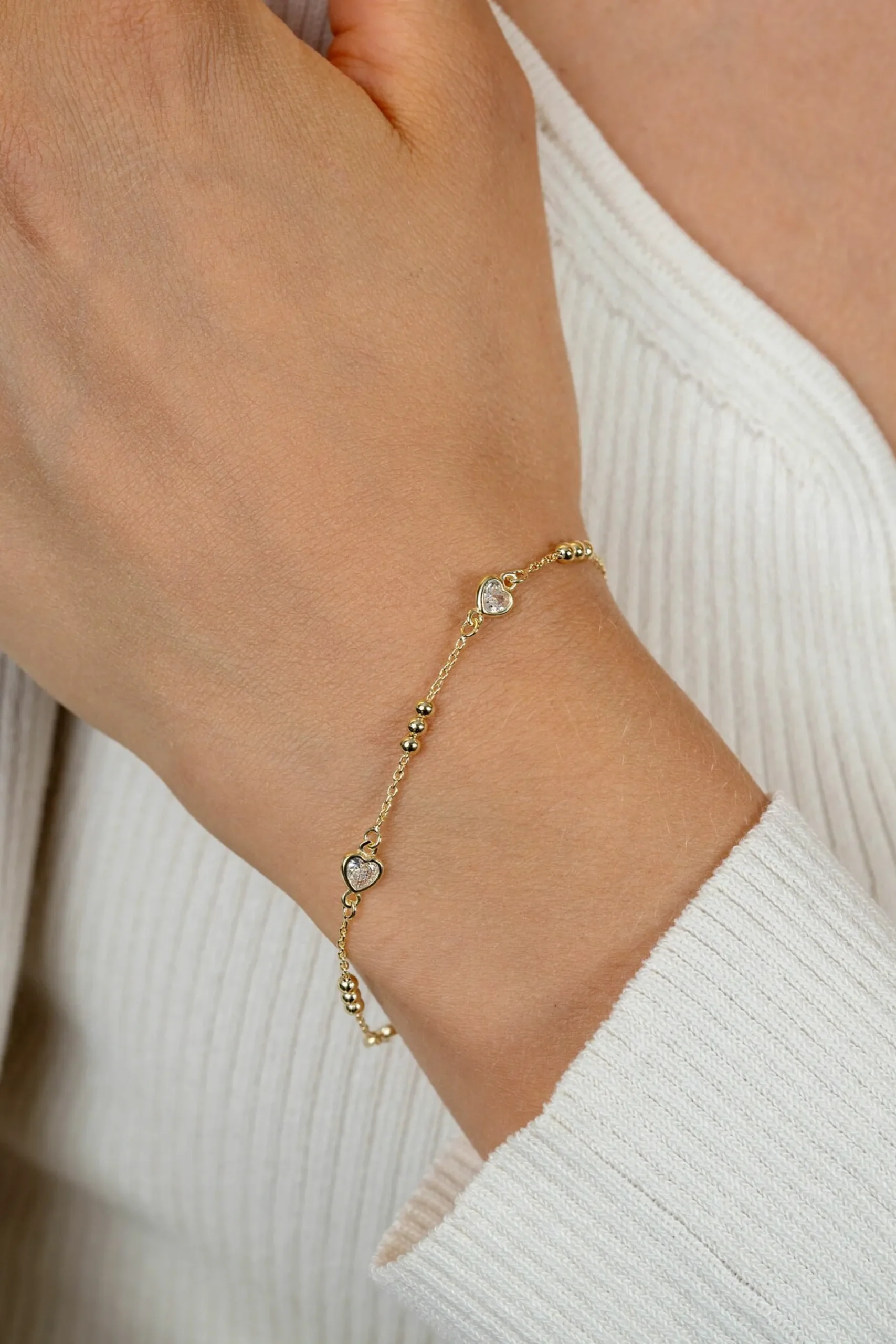 ZINZI gold plated zilveren schakelarmband met trio-bolletjes en drie hartvormige zirkonia's 17-20cm ZIA2679