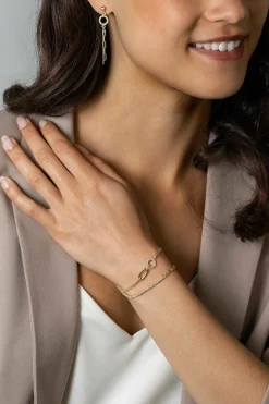 ZINZI gold plated zilveren fantasie schakel armband (2,3mm breed) waarbij de ene helft bezet is met witte zirconia's 17-20cm ZIA2460Y