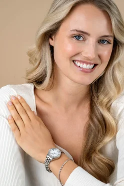 ZINZI Tresor horloge 32mm bezet met witte zirkonia's, parelmoer wijzerplaat en zilverkleurige stalen kast en schakelband ZIW2417