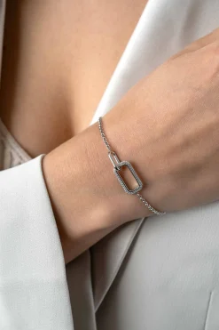 ZINZI zilveren armband met twee verbonden schakels: een rechthoekige bezet met witte zirconia's en een gladde ovale schakel 16,5-19,5cm ZIA2551