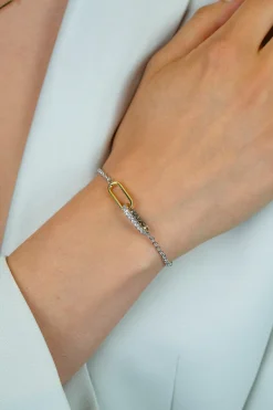 ZINZI zilveren schakelarmband met twee verbonden ovale schakels: ene gold plated, ander bezet met witte zirkonia's ZIA2758